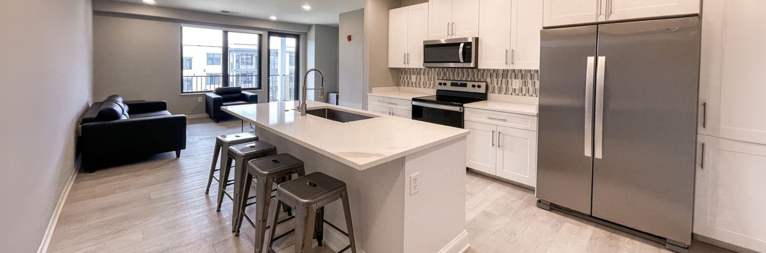 A kitchen with a two-door refrigerator